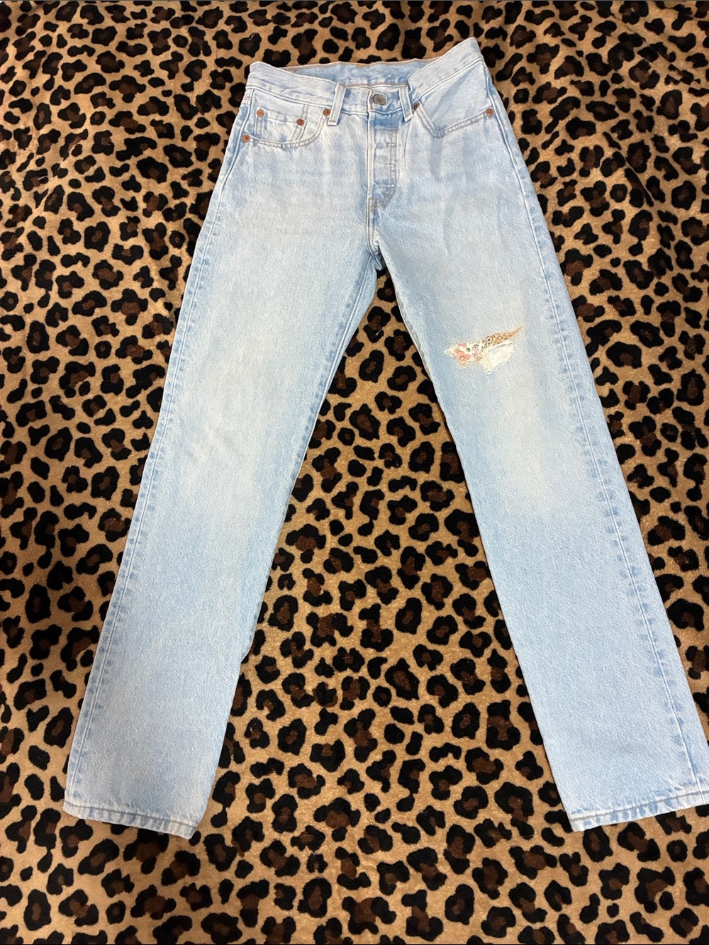 Levi's 501 Light Blue Straight Jeans with Subtle Distress